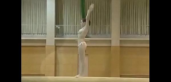  Hot gymnast gets topless for her routine